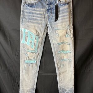 AMIRI Blue Skinny Distressed Jeans